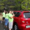 Washing a member's car with a song.